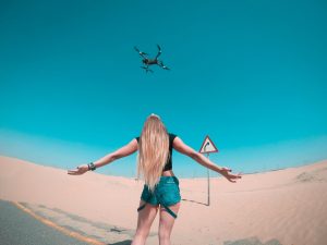 drone flying in dubai desert
