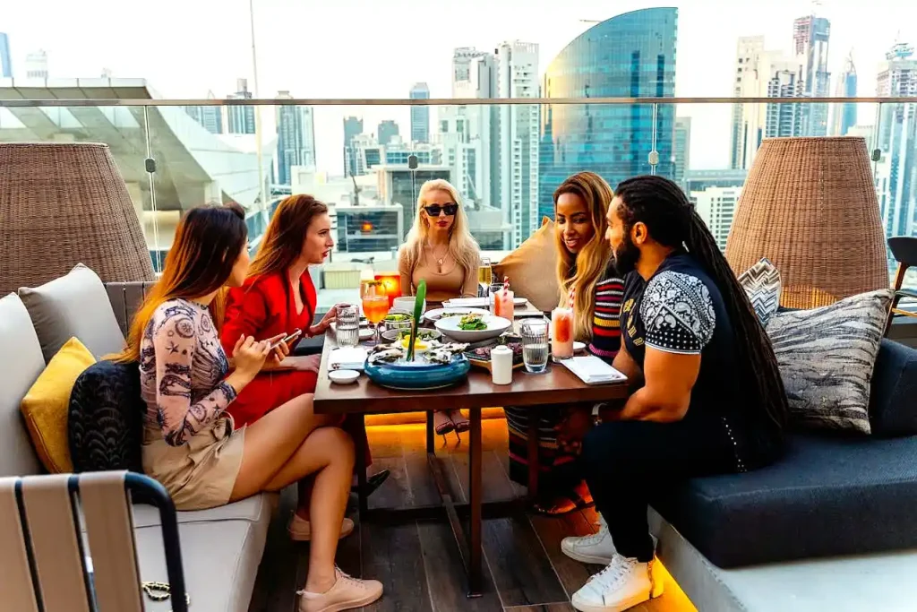 tourist of different racial having lunch at sky high resturant