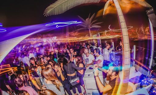 people having fun and enjoying night life of Ajman