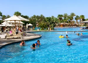 tourist enjoying poll activities in oman