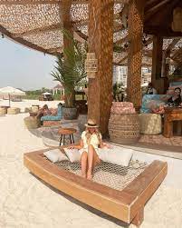 a woman enjoying on beach deck getting relaxtion