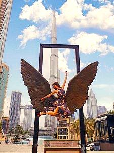 a woman posing jumping at Mexico wings in dubai