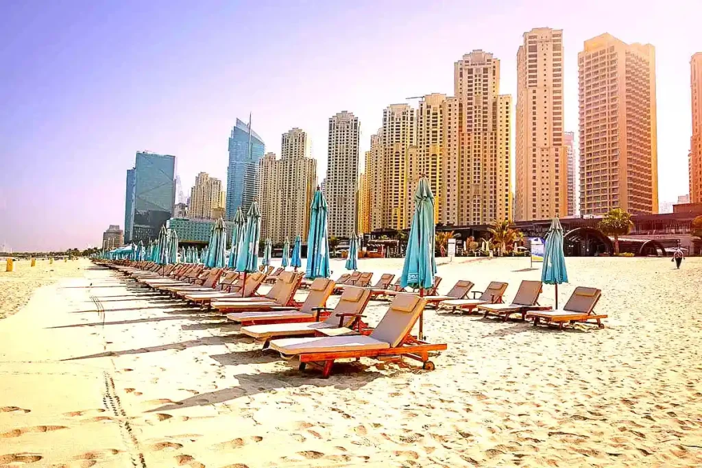 dubai JBR day view of beach deck chairs with embralla